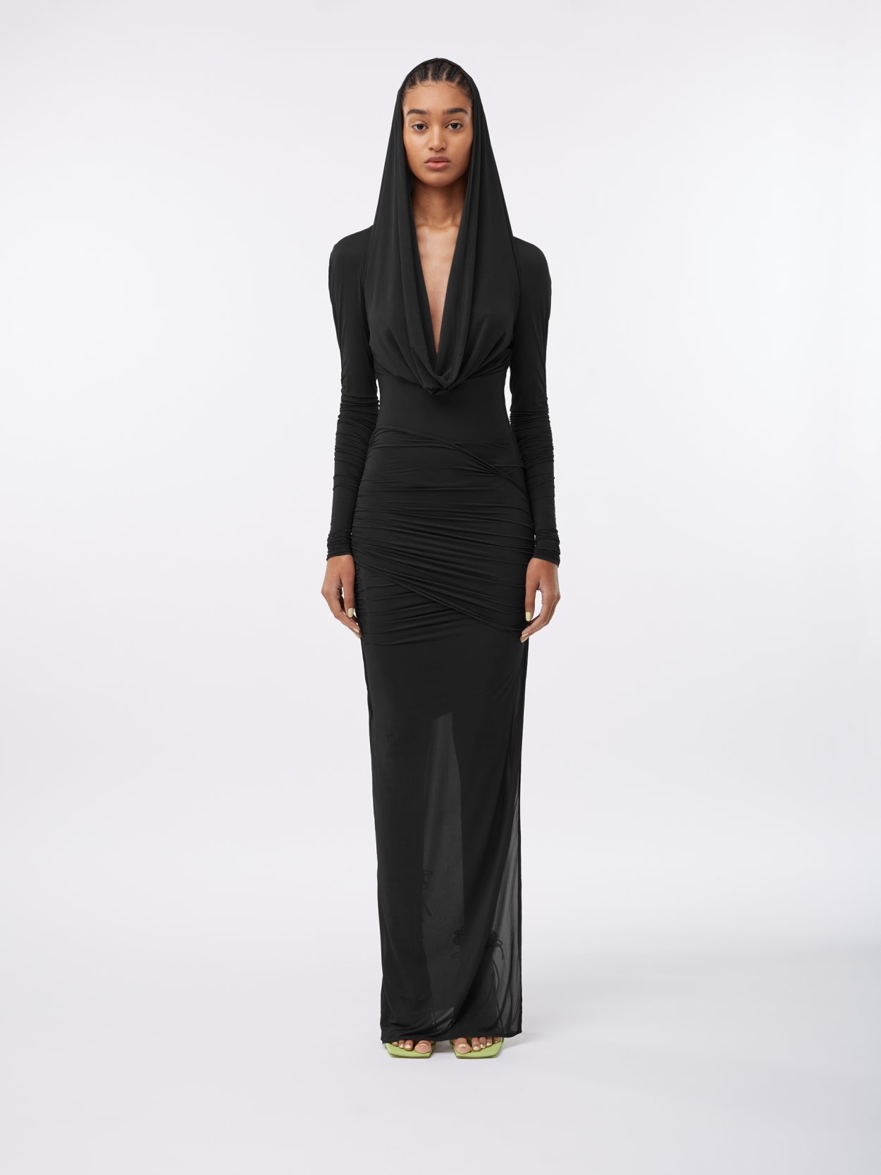model wearing a black hooded jersey draped dress
