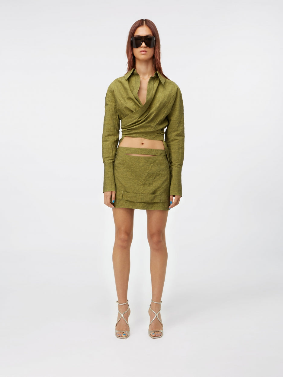 green mini skirt mid rise with cut outs and inserts