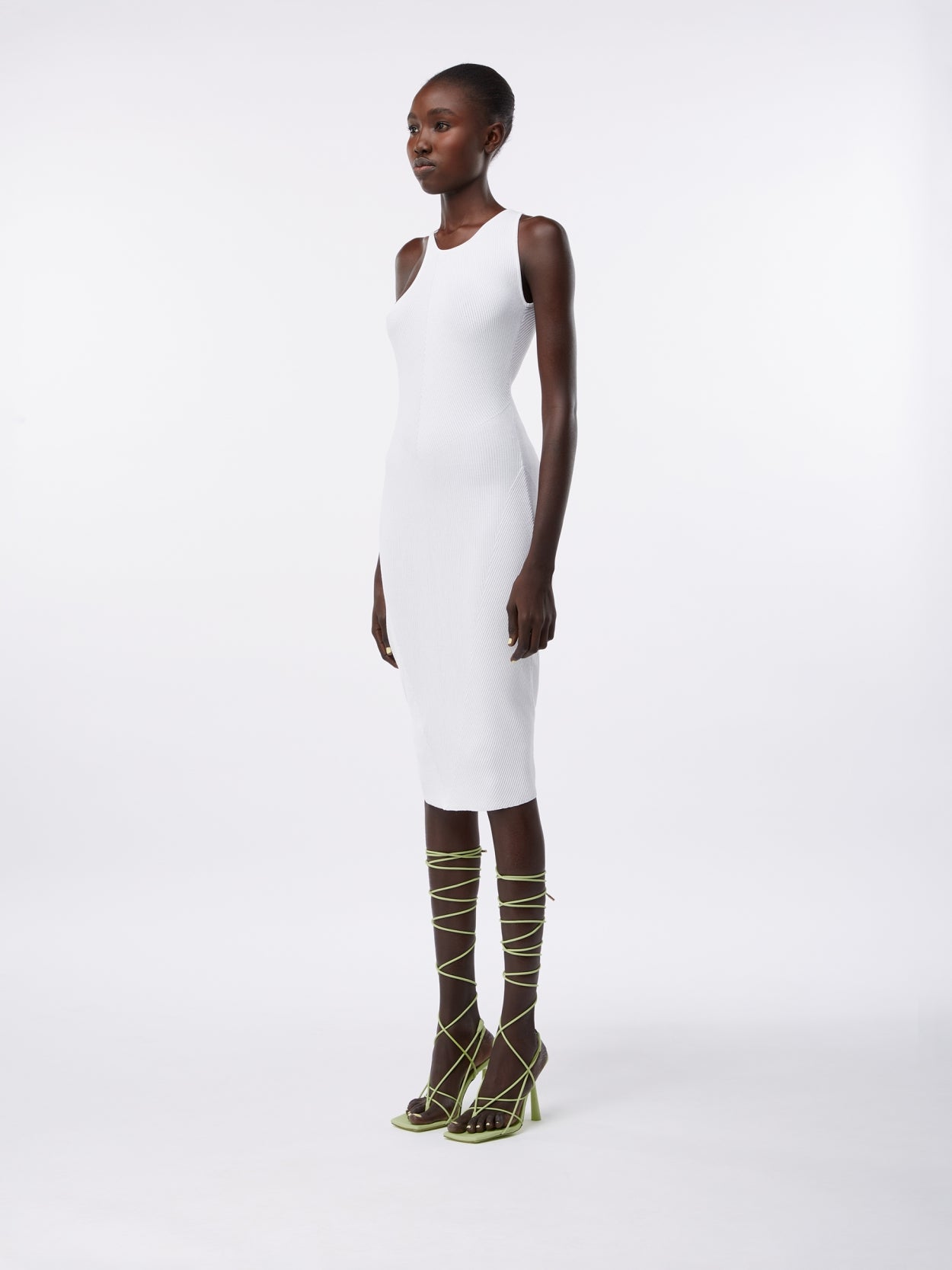 model wearing an asymmetric white midi dress