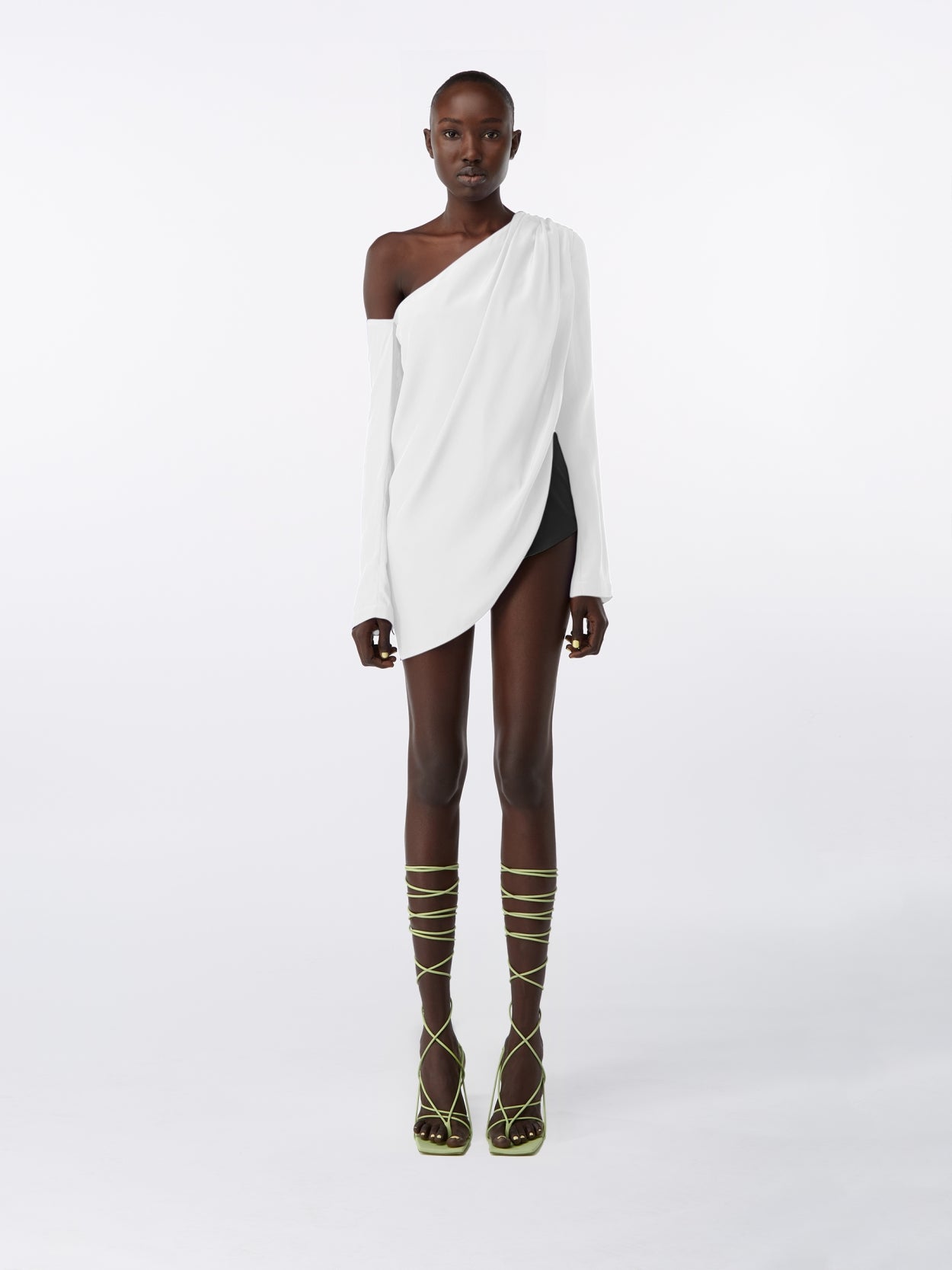 model wearing a white asymmetric long sleeve silk top