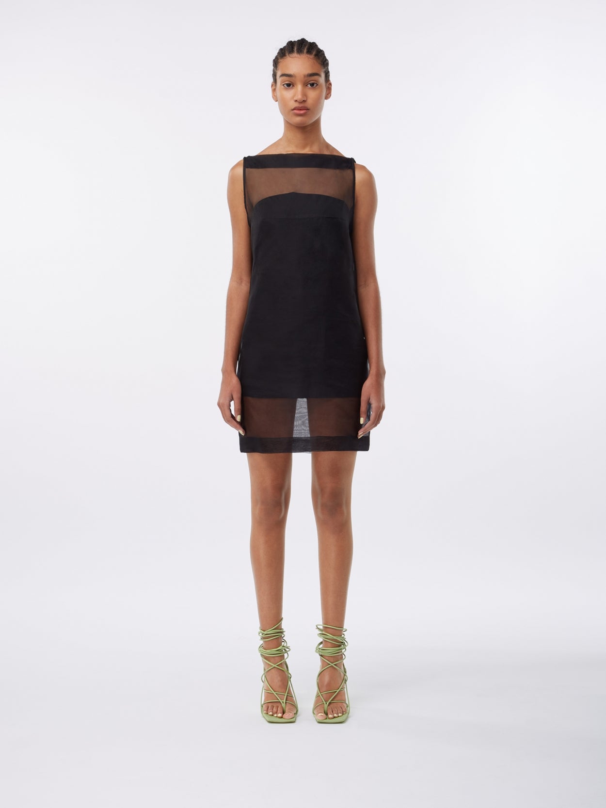 model wearing a black mesh overlay dress