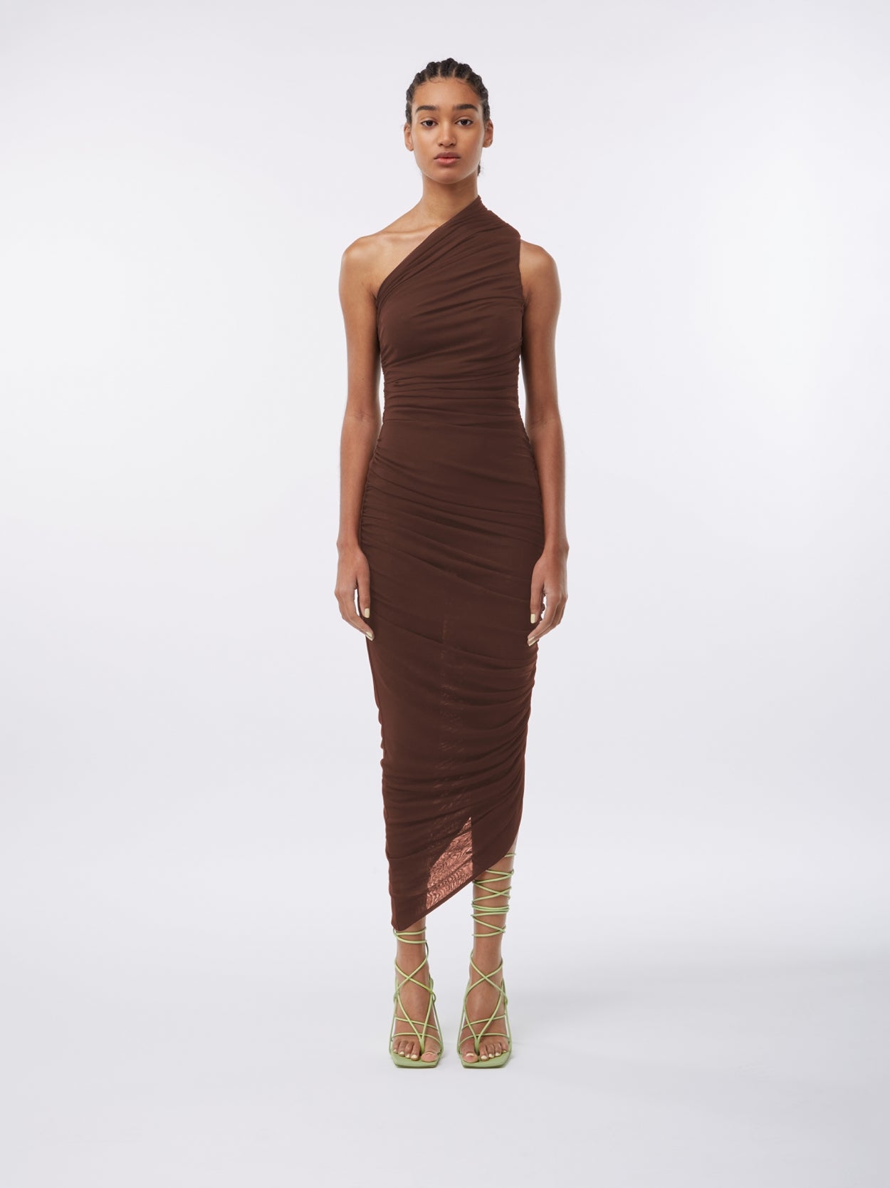 model wearing a one shoulder draped brown dress