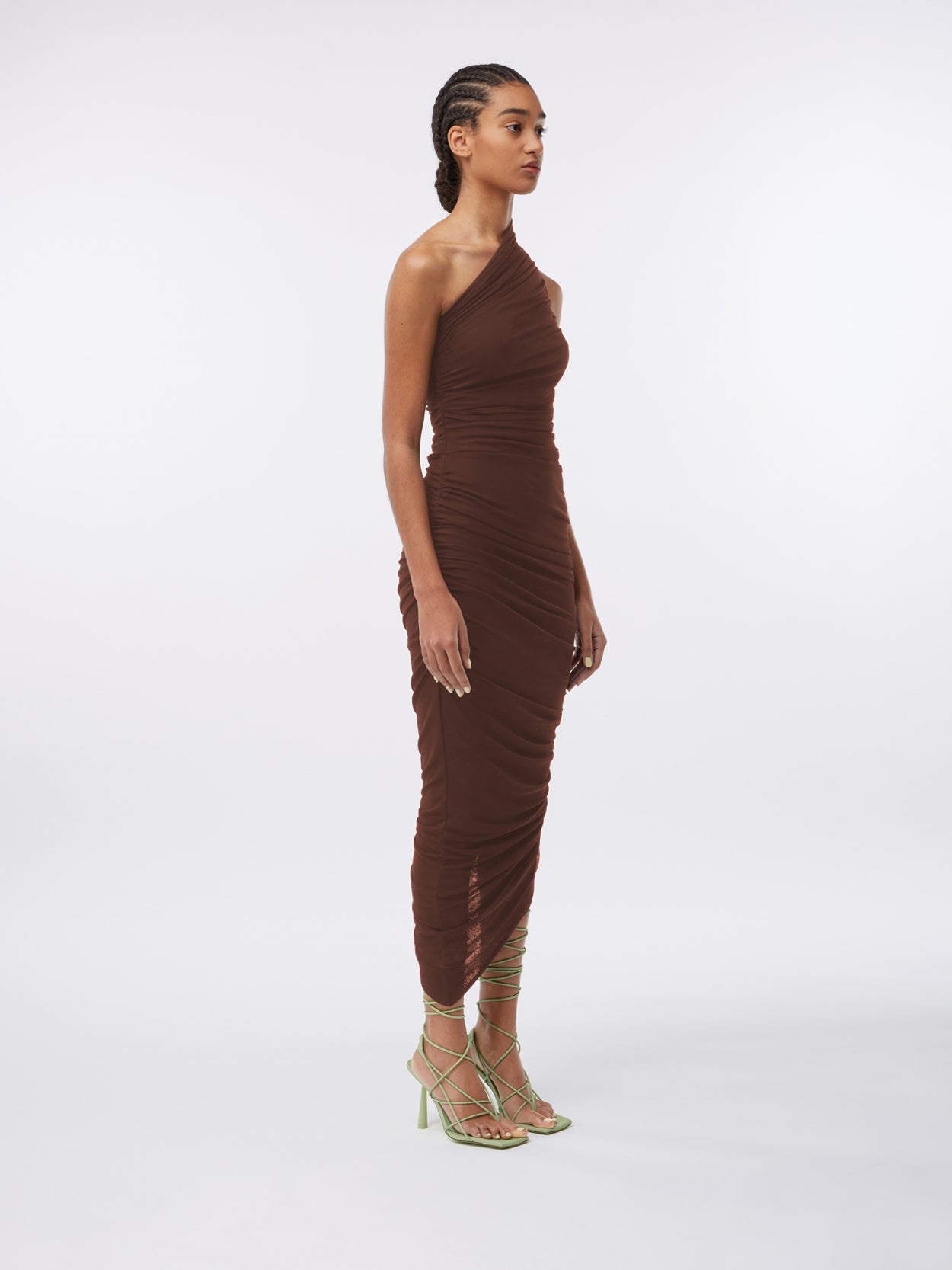 model wearing a one shoulder draped brown dress