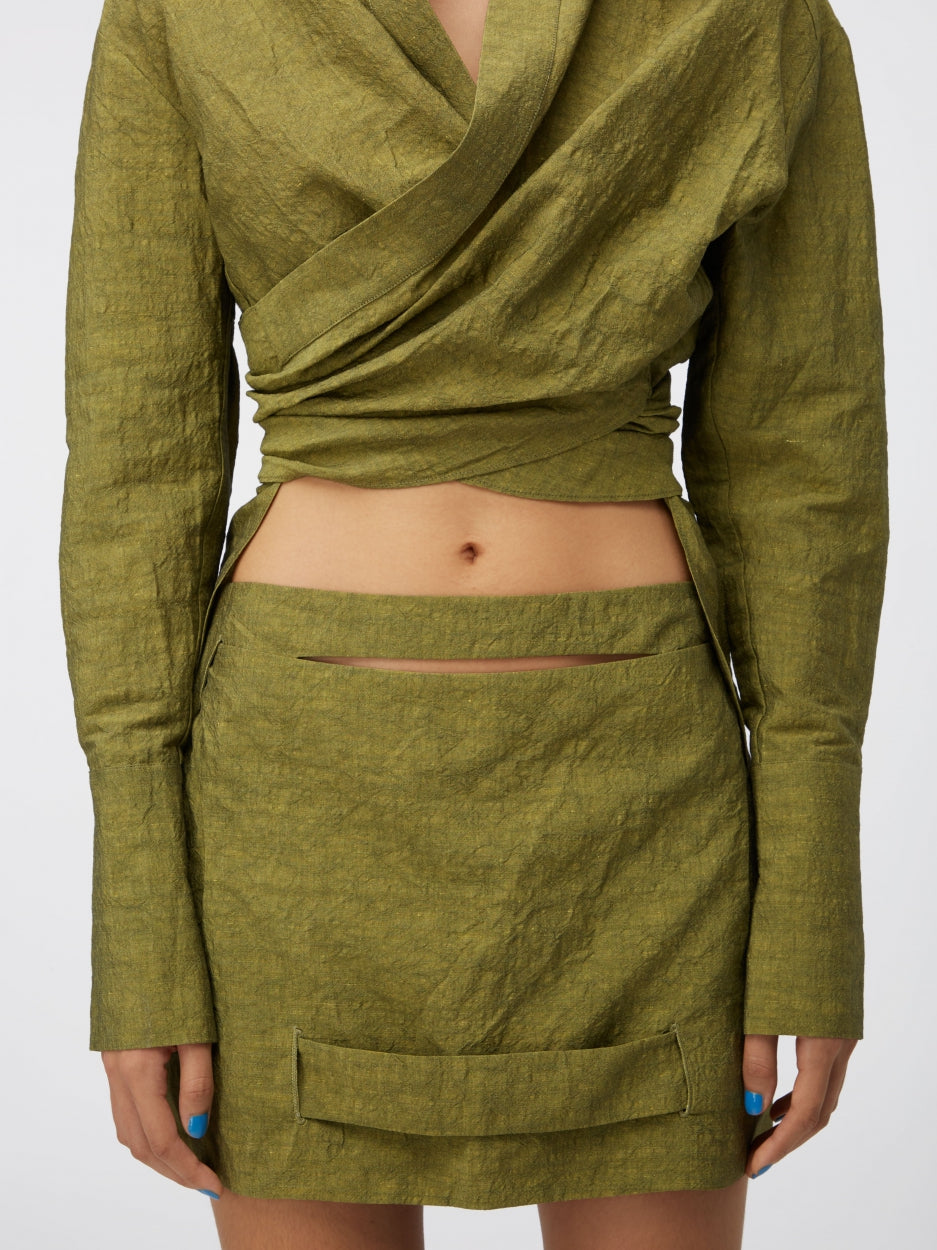 green mini skirt mid rise with cut outs and inserts