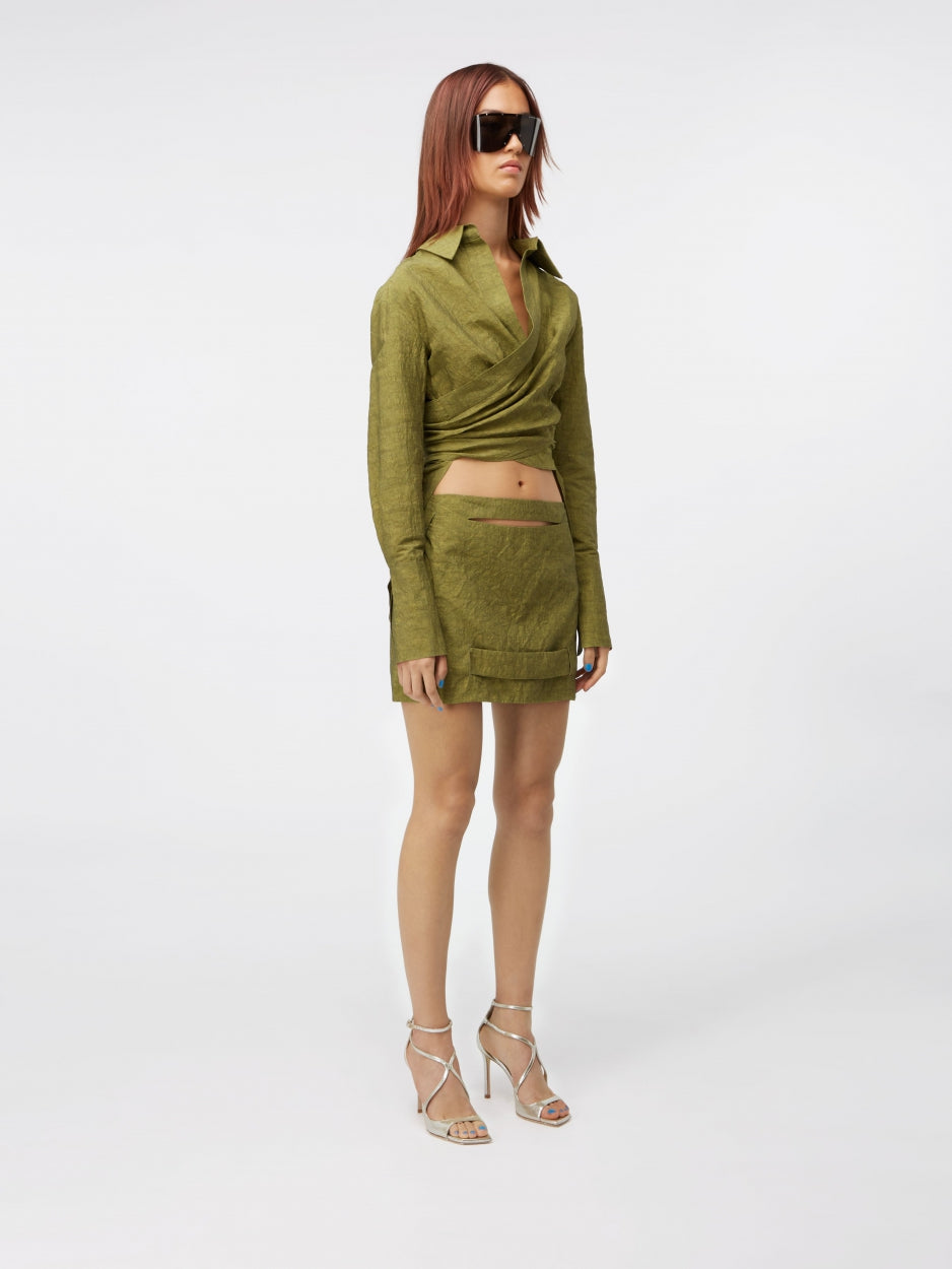 green mini skirt mid rise with cut outs and inserts